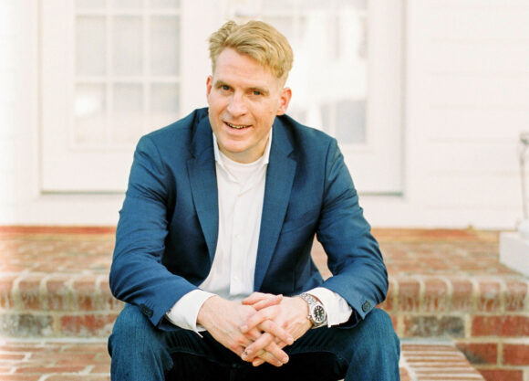 Greg Lindberg court photo with $1.6 billion restitution documents overlay