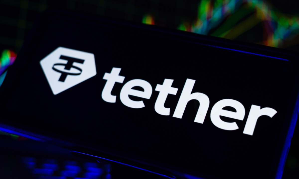 Paolo Ardoino, CEO of Tether, in a corporate setting—representing the high-stakes negotiation between crypto infrastructure and traditional finance valuations
