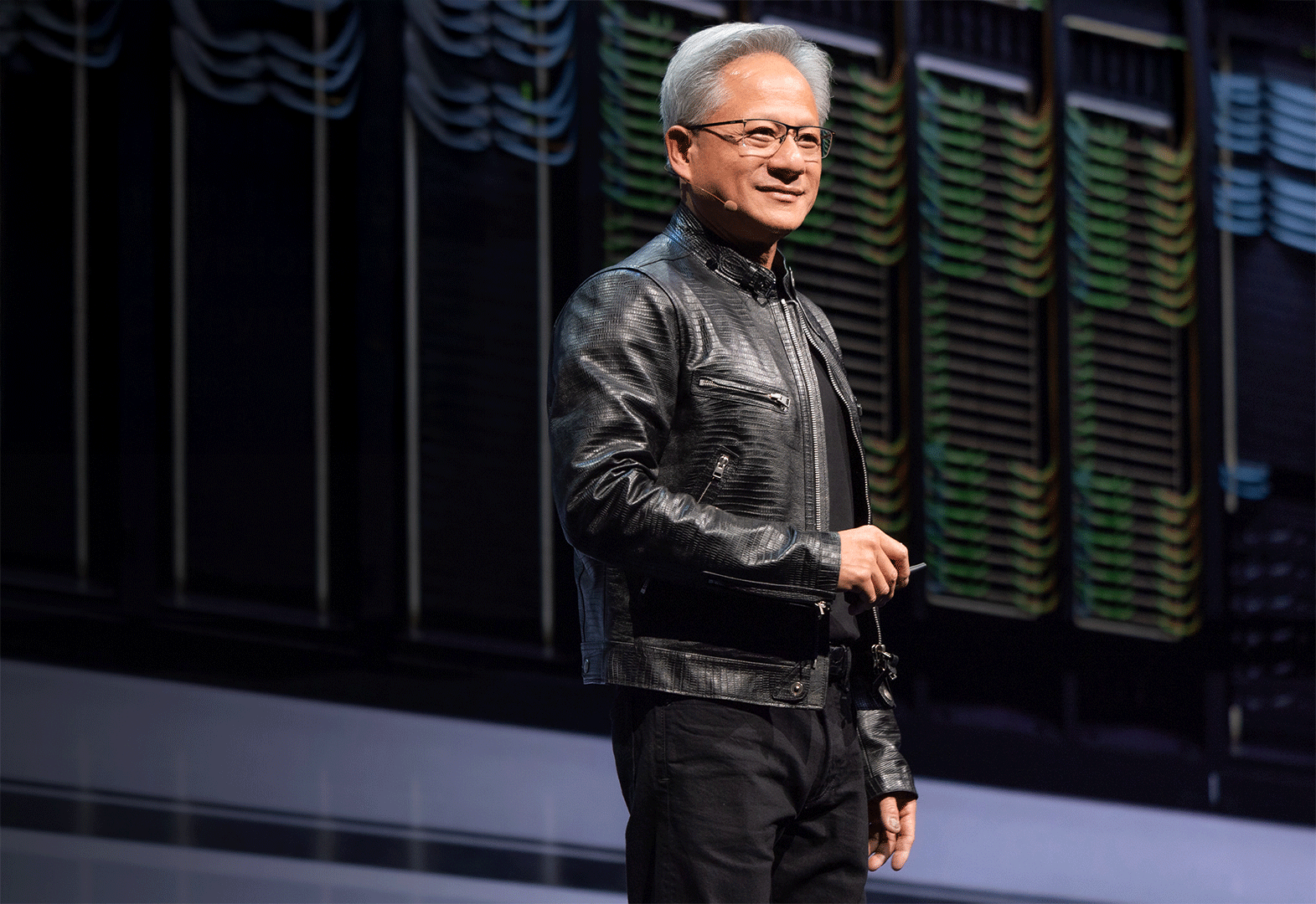 Nvidia CEO Jensen Huang speaking at a podium
