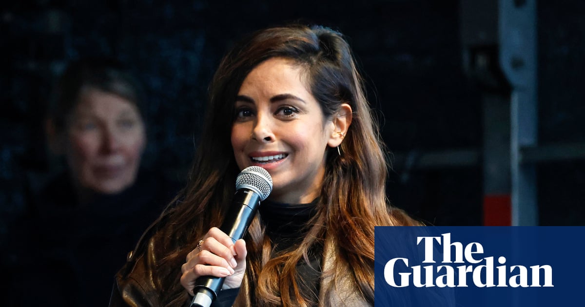 Protesters at Brandenburg Gate with signs protesting AI deepfakes and violence against women
