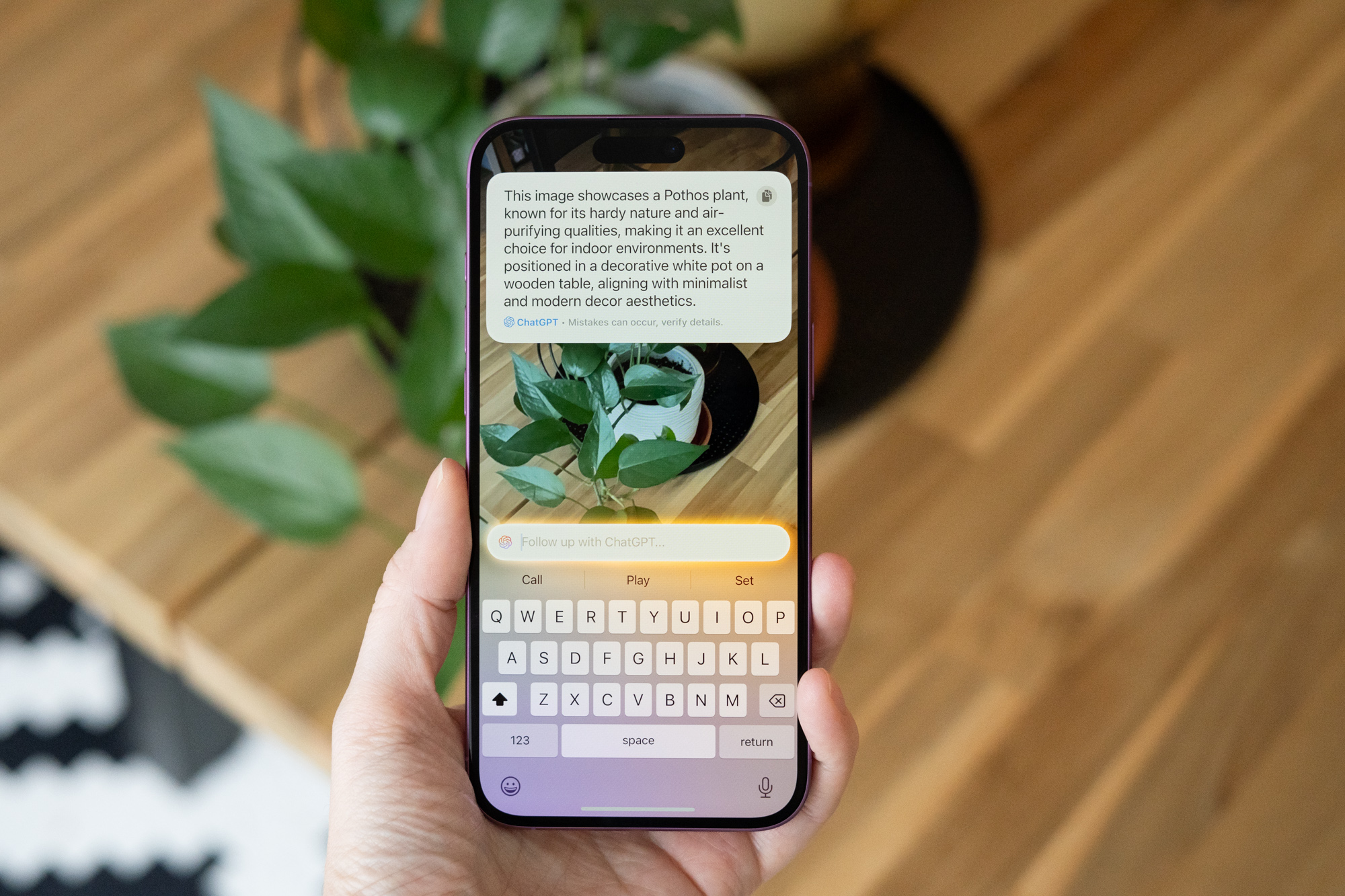 Renders of iOS 27 showing a pill-shaped Siri chat bubble emerging from the Dynamic Island with menu options including 'Ask, Siri, and ChatGPT'.