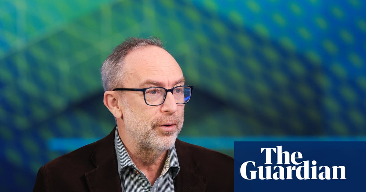 Jimmy Wales speaking at a podium
