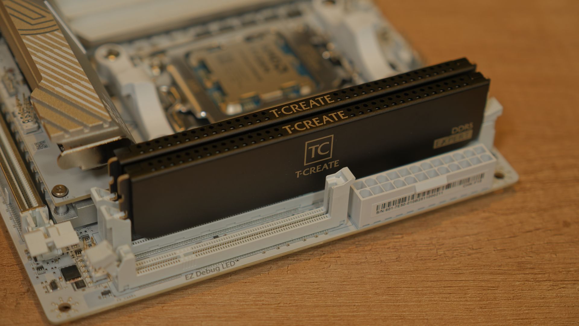 A close-up of a computer motherboard with RAM modules installed, symbolizing PC hardware.