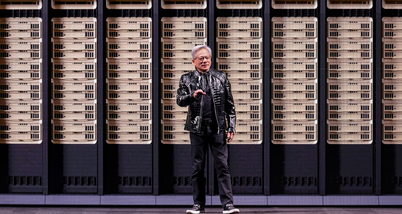 Jensen Huang unveiling NVIDIA Rubin platform on CES stage with holographic AI visuals