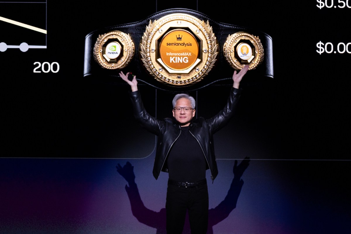 Jensen Huang in leather jacket delivering GTC keynote on stage with massive screens