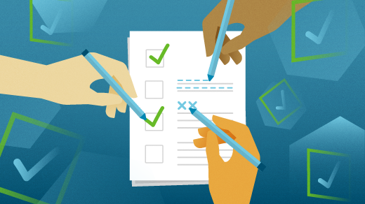 UX designer and developer high-fiving over shared laptop screen with wireframes and code