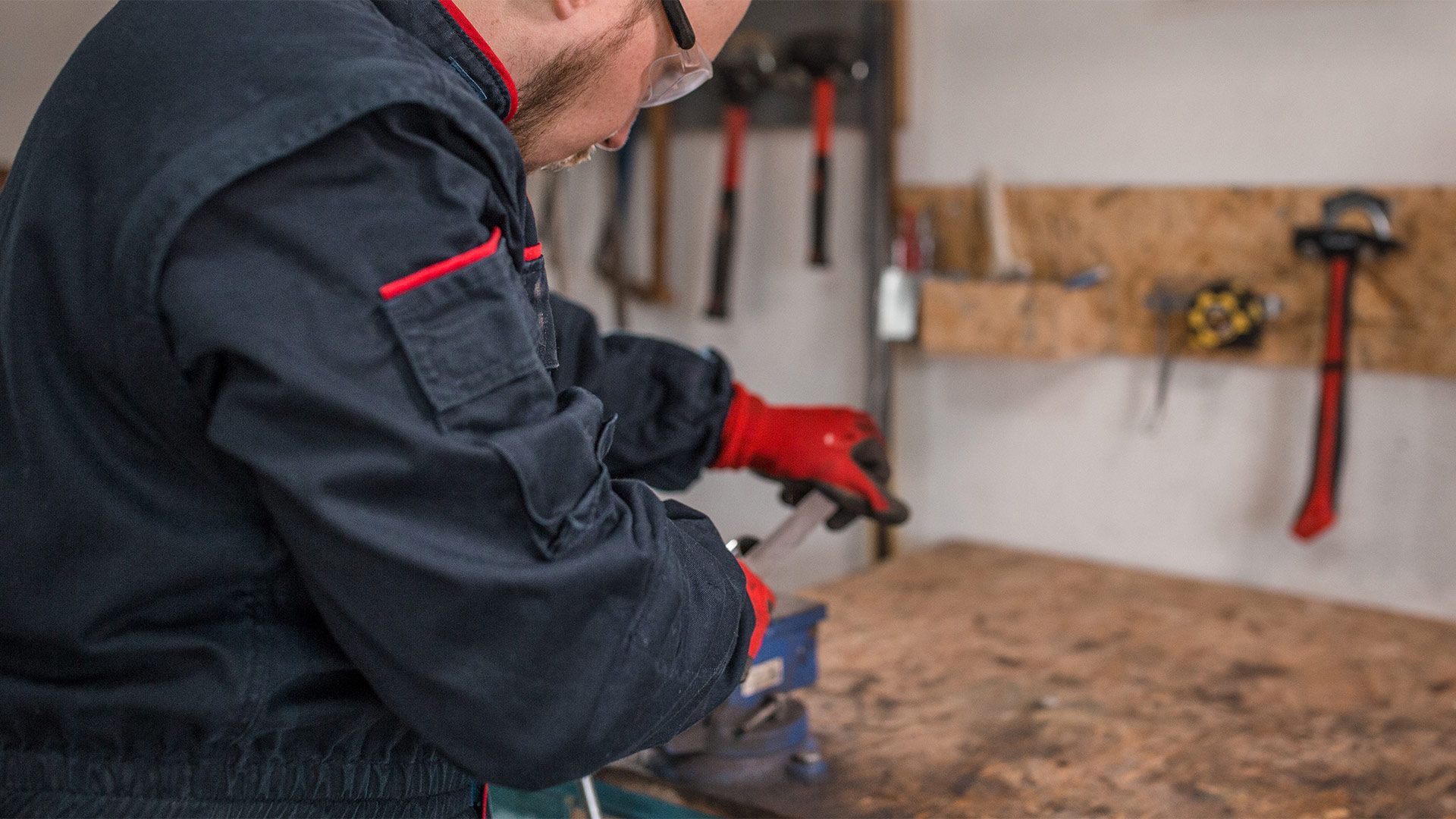 Close-up of a MacBook Pro with rounded, filed bottom edges revealing smooth aluminum bevel under palm rest