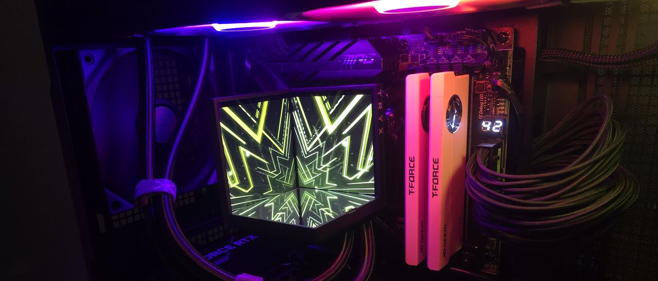 Tryx Stage 360 AIO CPU cooler with dual screens and mirror base on Ryzen motherboard