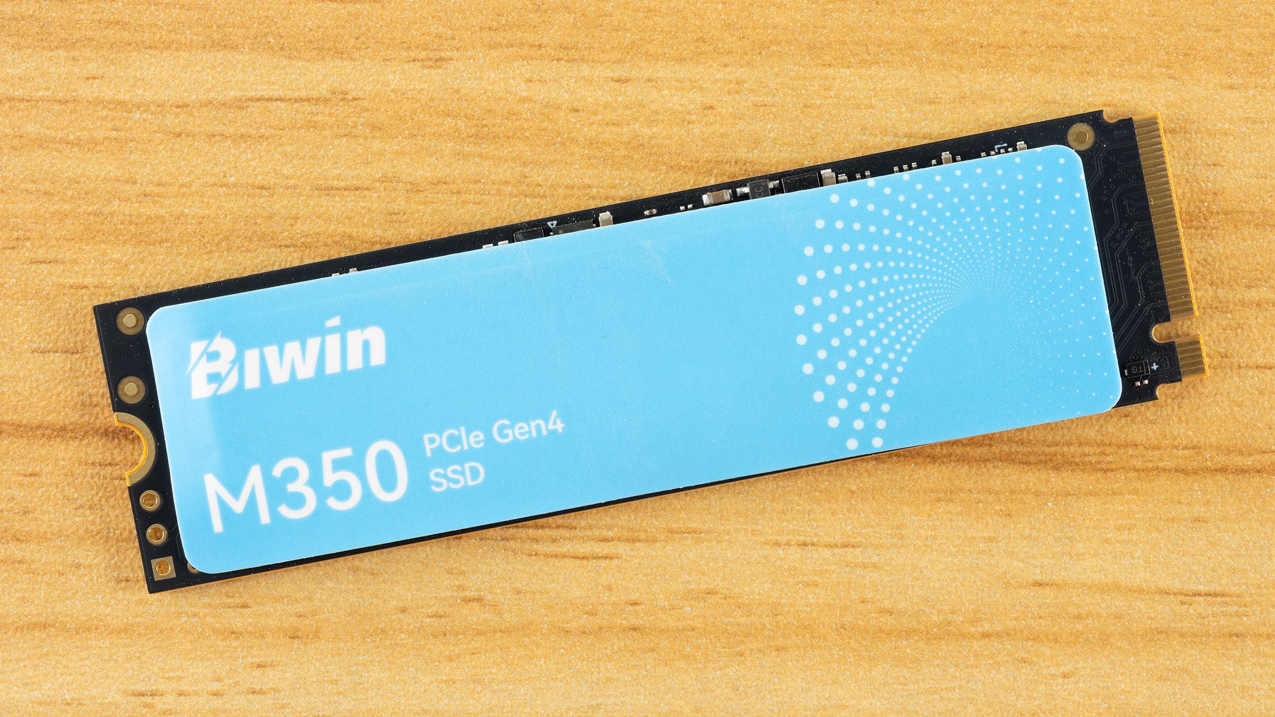 Close-up of a Biwin M350 2TB M.2 SSD circuit board.