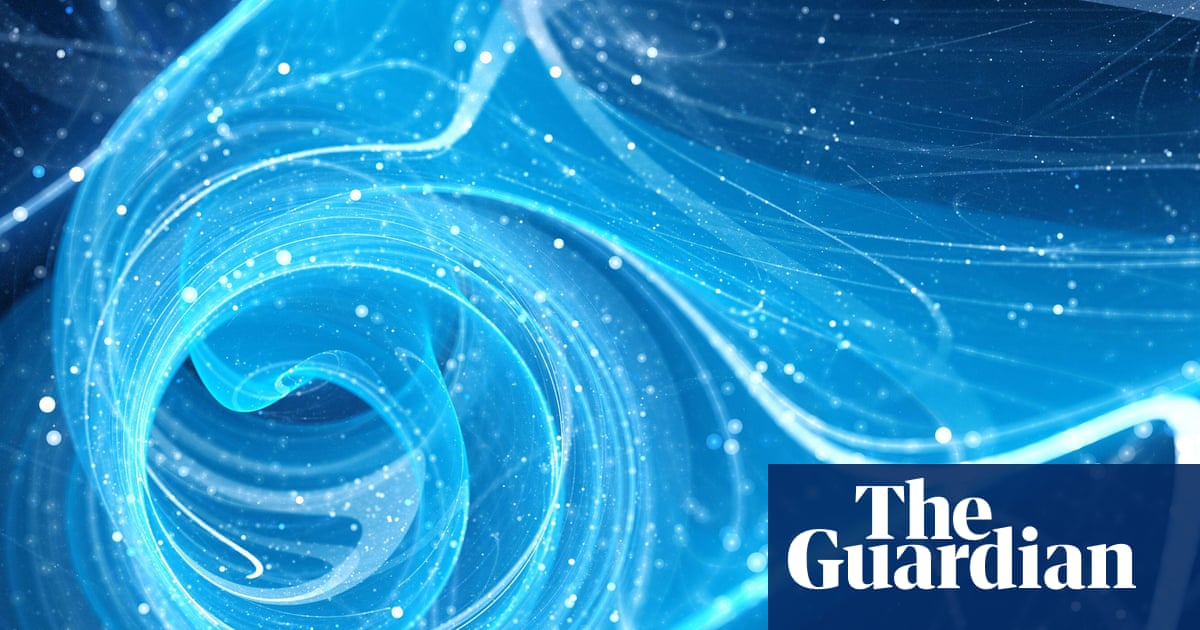 UK researchers debating funding cuts with quantum computer blueprint in background