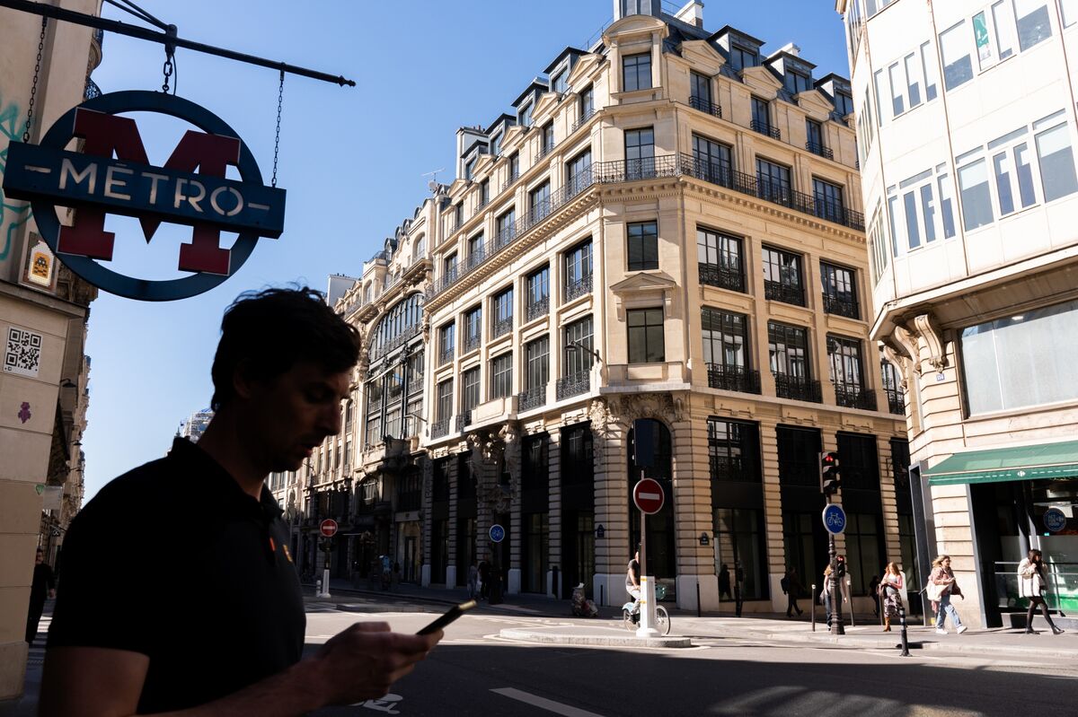 Revolut new Paris office exterior with fintech branding and Eiffel Tower in background