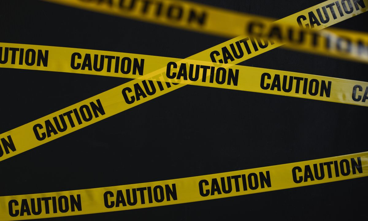 IMF report cover with crashing crypto charts and global finance symbols