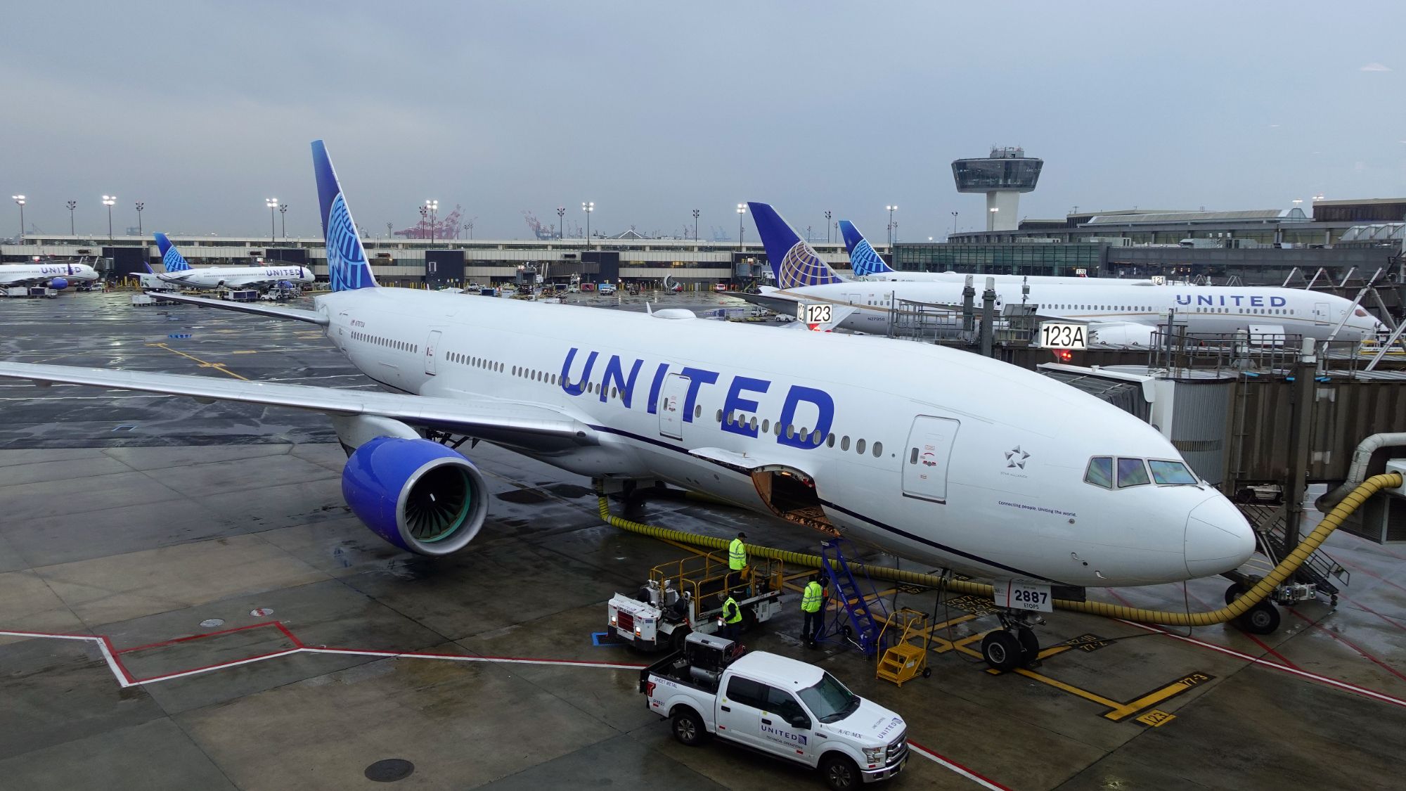 An image of a United Airlines plane on the tarmac at an airport.