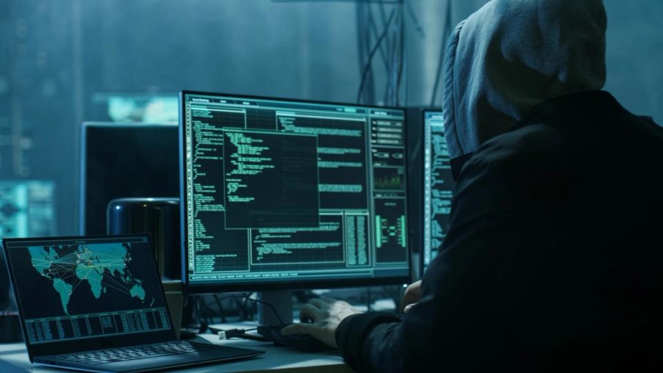 Shadowy figures at a crypto conference representing North Korean infiltration of DeFi teams