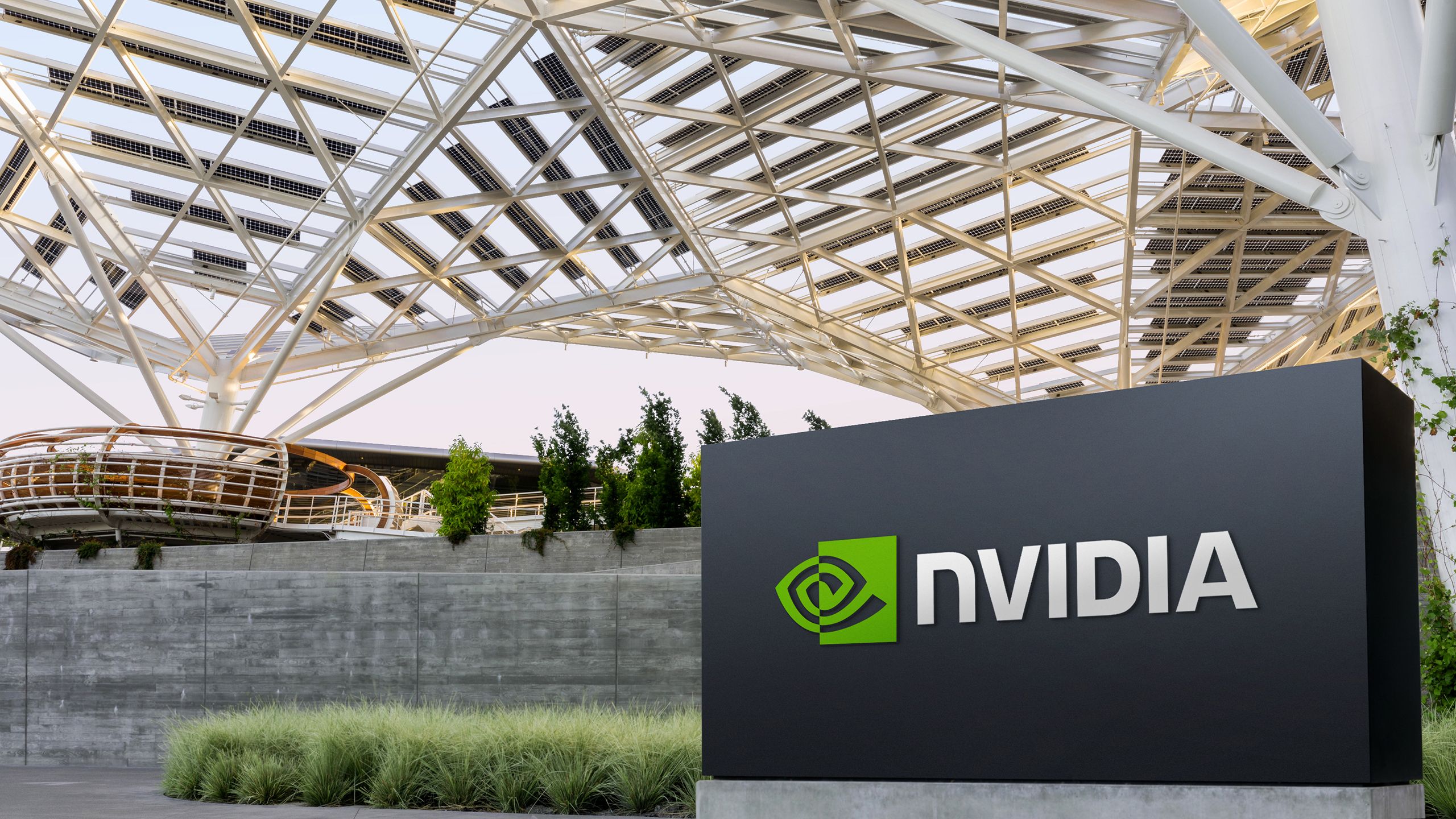Nvidia logo against a backdrop of glowing circuits and AI-themed graphics