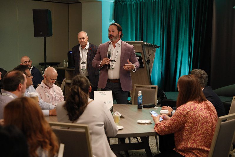 Credit union executives networking with fintech leaders at FinovateSpring Spotlight breakfast