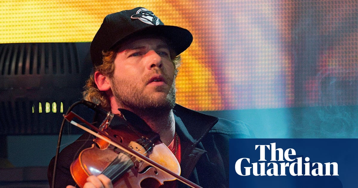 Screenshot of a search result page showing Google's AI Overview, with the name Ashley MacIsaac.