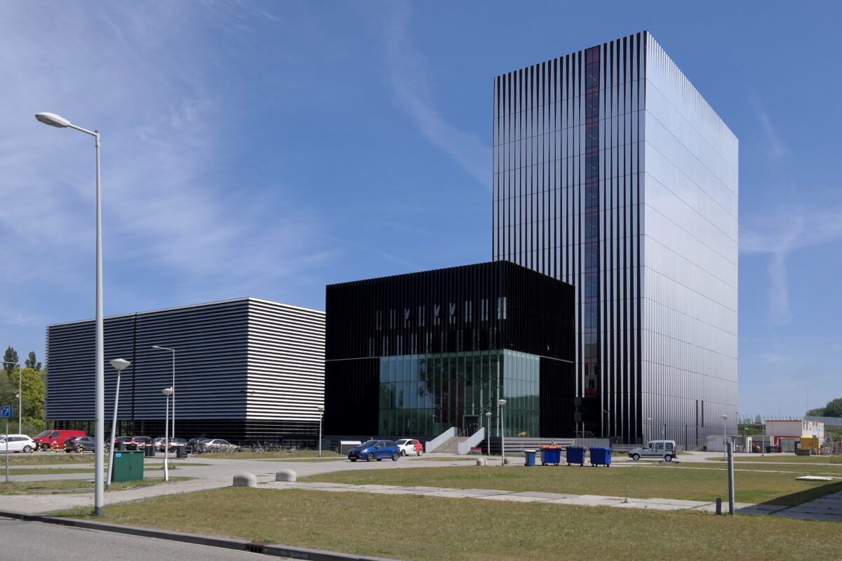 Massive AI data center with glowing server racks under dramatic lighting