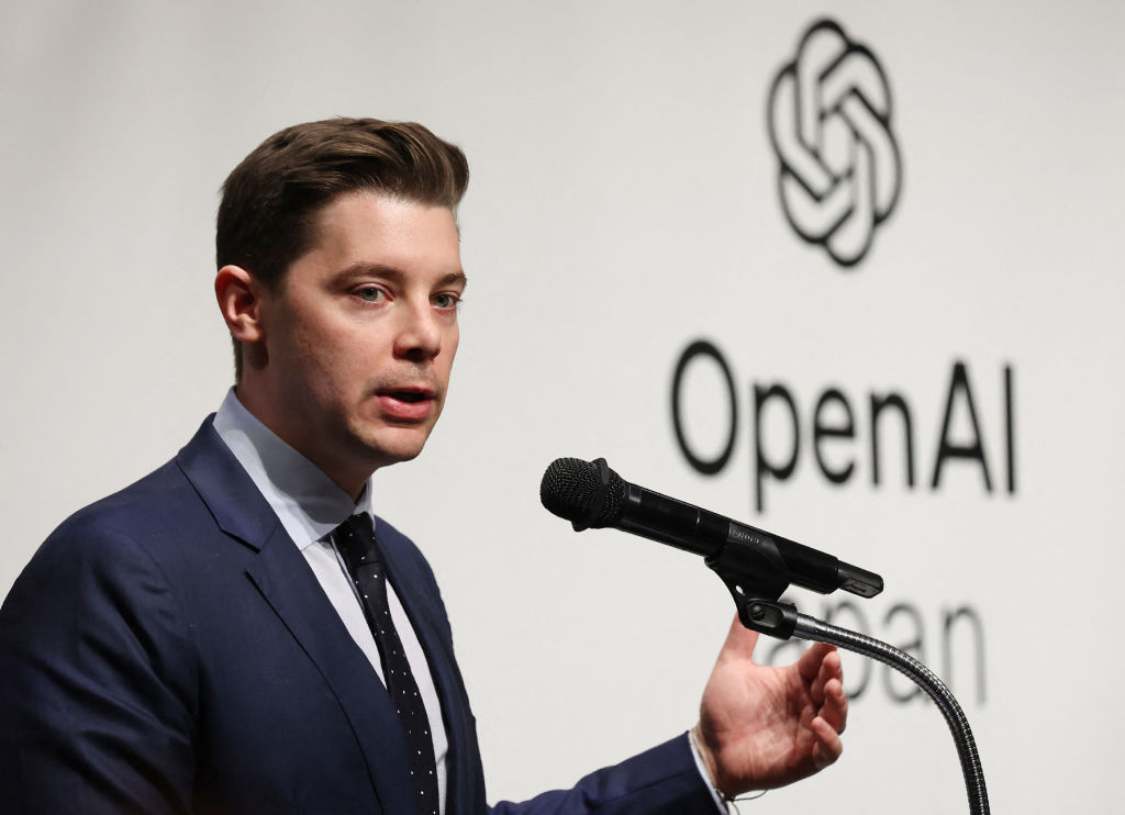 OpenAI executives Brad Lightcap and Sam Altman in discussion