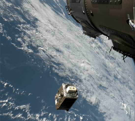 Starcloud satellite deploying GPUs in low Earth orbit against starry backdrop