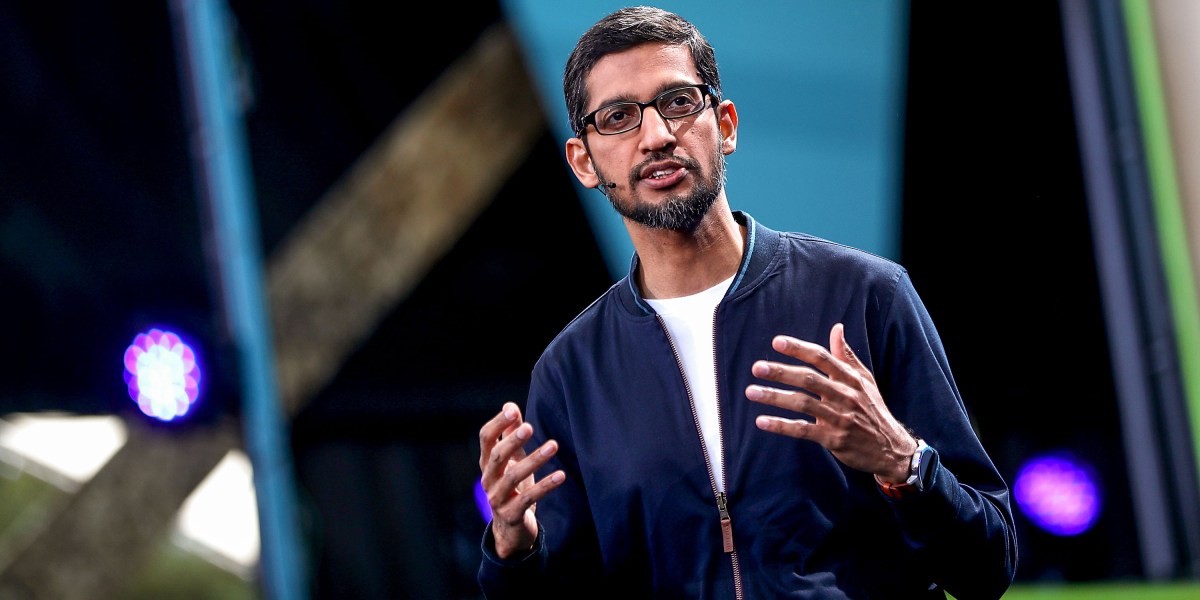 Google I/O conference banner with abstract AI graphics.