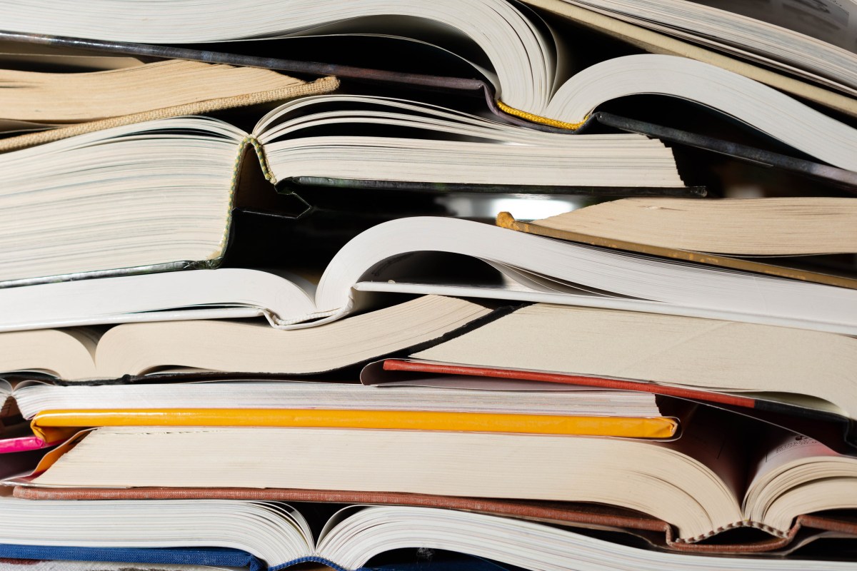 Shattered book cover of 'Shy Girl' horror novel with glowing AI circuits overlay